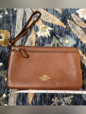 COACH Pebbled Double Zip Leather Wristlet in Saddle Brown